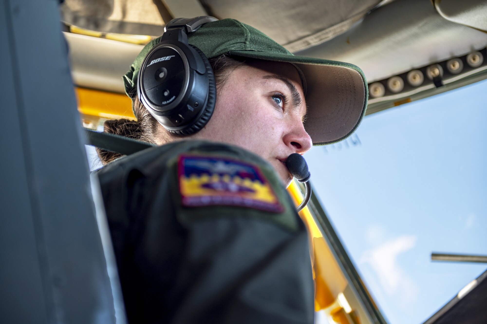 U.S. Air Force Capt. Christina Kelvin, 384th Air Refueling Squadron pilot, flies a KC-135 Stratotanker en route to Eielson Air Force Base, Alaska, March 7, 2023. Aircrew from the 384th Air Refueling Squadron conducted an air refueling coronet with Marines from the Marine Fighter Attack Squadron 312, demonstrating the critical role mobility forces have in projecting the joint force anywhere, anytime. (U.S. Air Force photo by Staff Sgt. Lawrence Sena)