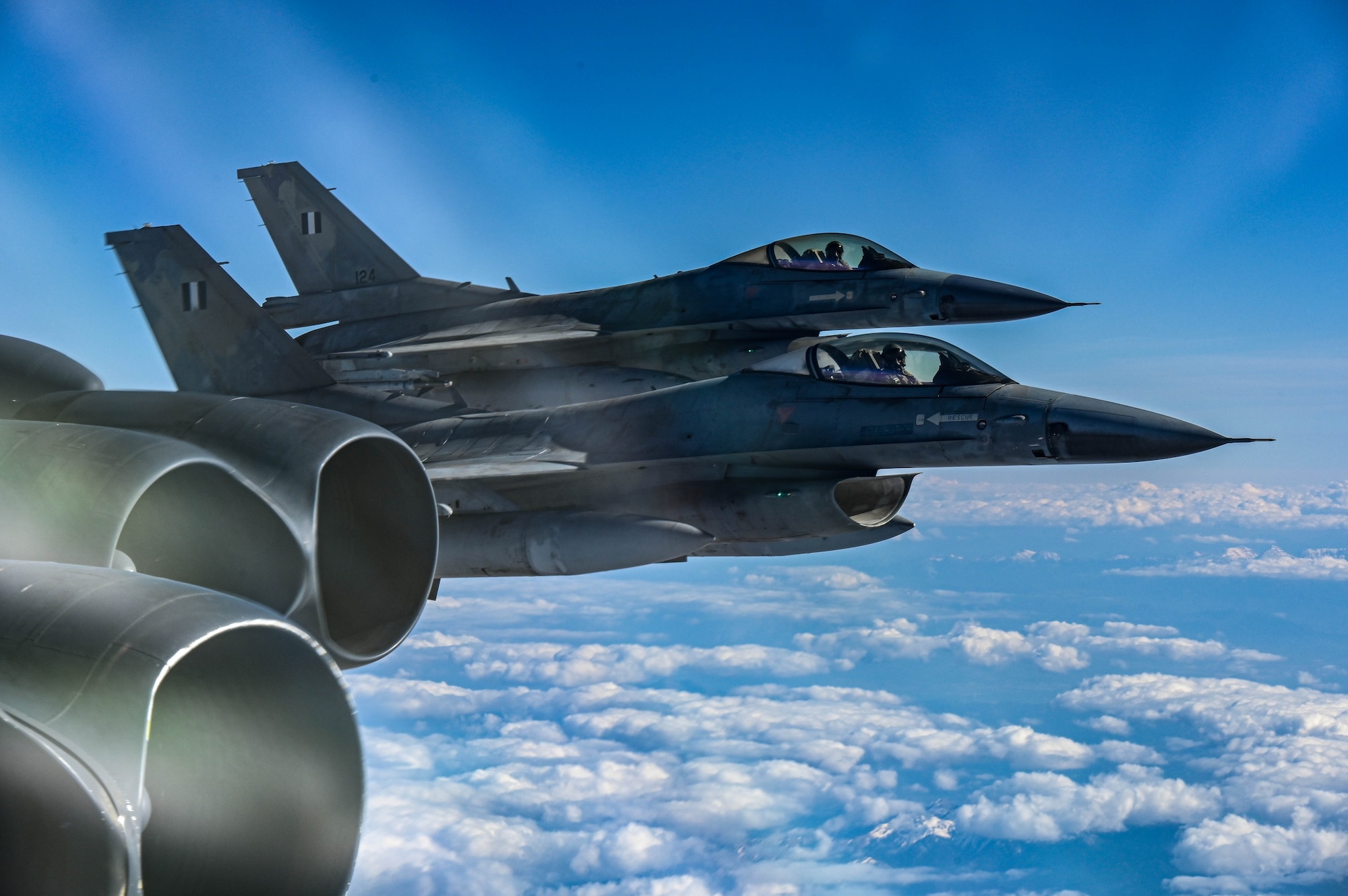 Two Hellenic Air Force F-16s fly in formation with a U.S. Air Force B-52H Stratofortress assigned to the 23rd Expeditionary Bomb Squadron during a Bomber Task Force mission in Greece, March 22, 2023. Bomber Task Force missions demonstrate the credibility of our forces to address a global security environment that is more diverse and uncertain than at any other time in recent history. (U.S. Air Force photo by Senior Airman Zachary Wright)
