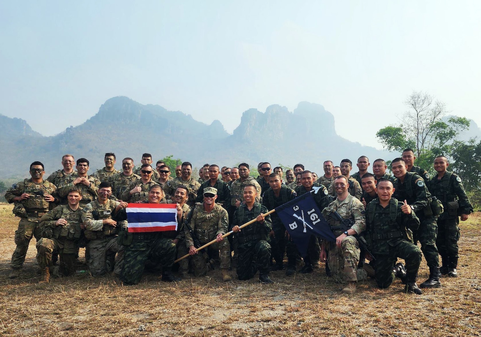 Washington National Guard Soldiers from Bear Company, 3rd Battalion, 161st Infantry Regiment, with their Royal Thai Army counterparts from 1st Battalion, 21st Mechanized Infantry Regiment, at the completion of training March 13, 2023, in the Kingdom of Thailand. The partners in the State Partnership Program learned how to survive in a jungle as part of exercise Cobra Gold 2023.