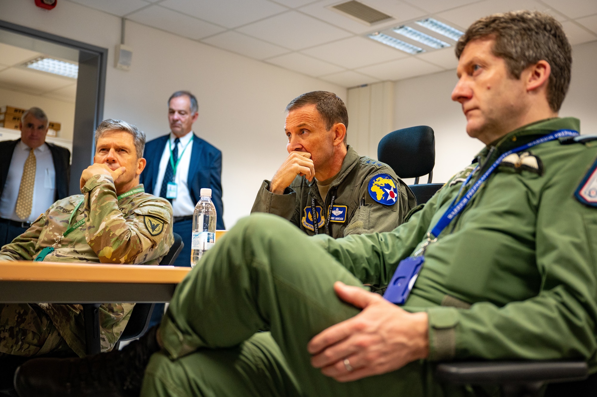 Lt. Gen. John Lamontagne, U.S. Air Forces in Europe-Air Forces Africa deputy commander (center), Air Marshal Johnny Stringer, Royal Air Force, Allied Air Command deputy commander (right), and U.S. Army Maj. Gen. Peter Andrysiak, U.S. European Command J-3 director (left), receive a situation brief during European Test Bed Senior Leader Seminar at Einsiedlerhof Air Station, Germany, Nov. 4, 2022. ETB is an experimentation venue where the U.S. and NATO can explore, evaluate and align concepts and strategies to defend Europe from air and missile attacks. (U.S. Air Force photo by Staff Sgt. Steven M. Adkins)