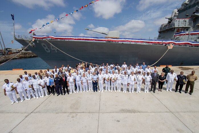 Leaders attending the African Maritime Forces Summit (AMFS) pose for a photo in front of USS Bulkeley (DDG 84) while moored in Sal Island, Cabo Verde, Mar. 21, 2023. The leaders visited Bulkeley in support of the African Maritime Forces Summit (AMFS), March 20-22. Hosted by U.S. Naval Forces Europe and Africa (NAVEUR-NAVAF), the African Maritime Forces Summit (AMFS) is a strategic-level forum that brings African maritime and naval infantry leaders together with their international partners to address transnational maritime security challenges within African waters including the Atlantic Ocean, Indian Ocean, and Mediterranean Sea.