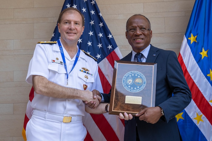 Adm. Stuart B. Munsch, U.S. Naval Forces Europe and Africa Commander (left) presents Ulisses Correia e Silva, Prime Minister of the Republic of Cabo Verde (right), a plaque at the African Maritime Forces Summit (AMFS), Mar. 20, 2023. The African Maritime Forces Summit (AMFS), hosted by U.S. Naval Forces Europe and Africa (NAVEUR-NAVAF), is a strategic-level forum that brings African maritime and naval infantry leaders together with their international partners to address transnational maritime security challenges within African waters including the Atlantic Ocean, Indian Ocean, and Mediterranean Sea.