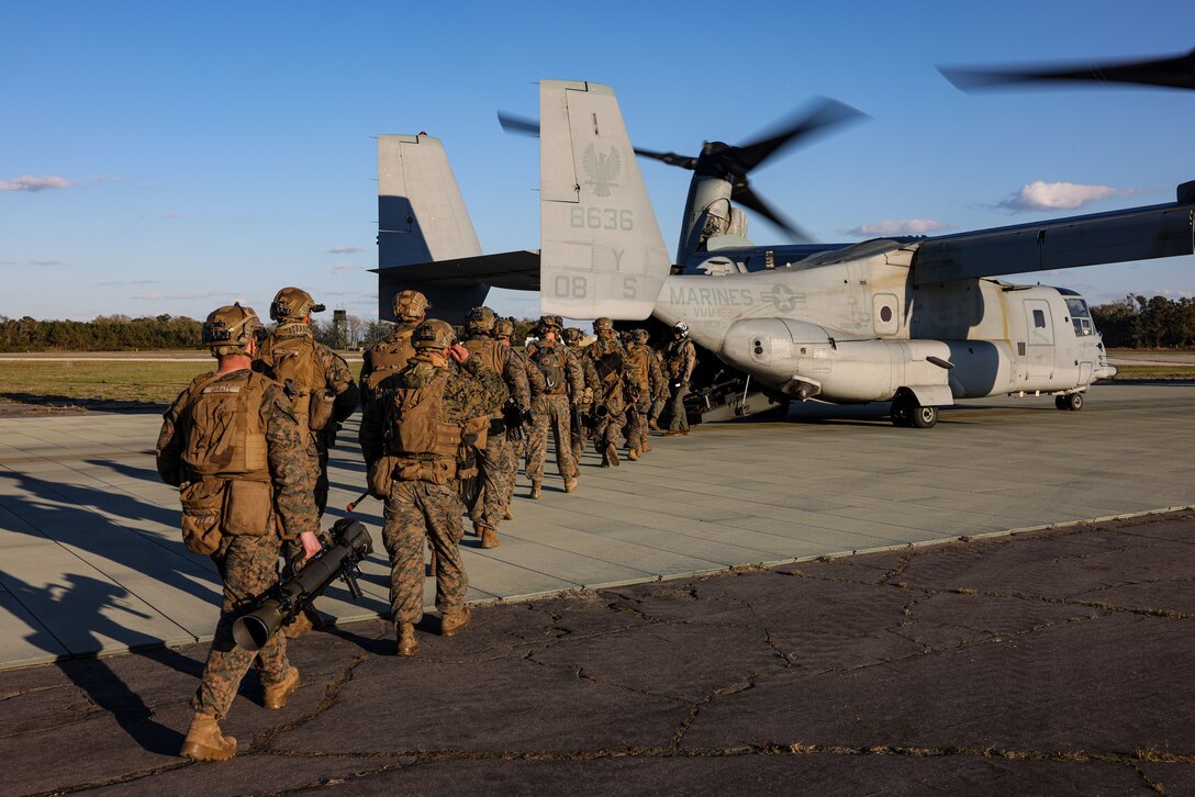 U.S. Marines with 26th Marine Expeditionary Unit (MEU) load into an MV-22B Osprey prior to executing a full mission profile raid during MEU Exercise (MEUEX) III on Marine Corps Auxiliary Landing Field Bogue, North Carolina, March 14, 2023. The raid was part of a scenario during MEUEX III designed to sharpen the MEU’s ability to conduct critical mission essential tasks and become more lethal in preparation for the upcoming deployment. (U.S. Marine Corps photo by Lance Cpl. Rafael Brambila-Pelayo)