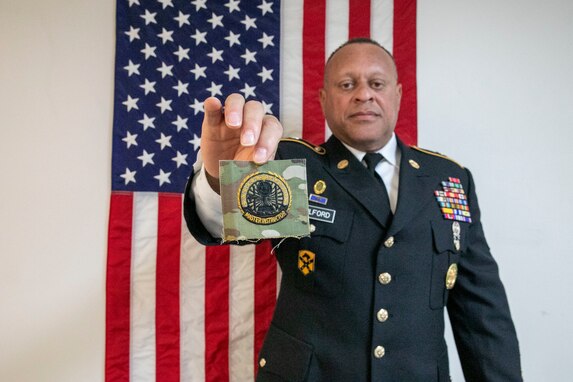 Nebraska Army National Guard Staff Sgt. Darrin Fulford, senior small group leader, 1-209th Regiment (Regional Training Institute), holds a Master Army Instructor Badge at Camp Ashland, Nebraska, Jan. 11, 2023.