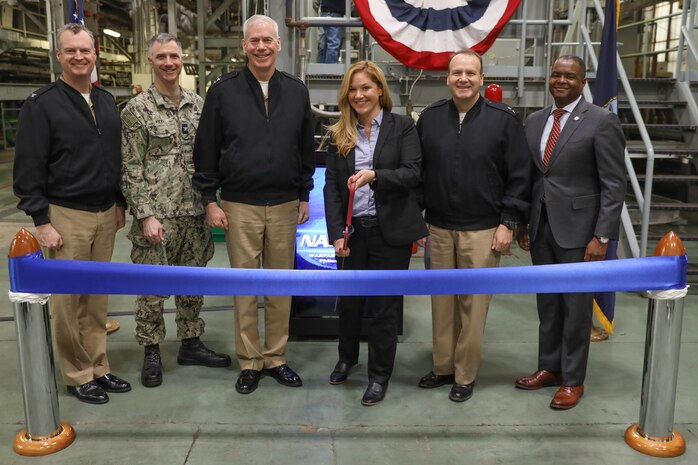 (From left) Naval Surface Warfare Center, Philadelphia Division (NSWCPD) Commanding Officer Capt. Joseph Darcy; PMS 460 Deputy Program Manager Capt. Dan Kidd; Director, Surface Warfare Division (N96) Office of the Chief of Naval Operations Rear Adm. Fred Pyle; Program Manager, PMS 460, Guided Missile Destroyer (DDG(X)), Program Executive Office Ships Katie Connelly; Program Executive Officer (PEO) for Ships Rear Adm. Thomas J. Anderson; and NSWCPD Technical Director Nigel C. Thijs cut a ribbon, signifying the opening of the Next Generation Guided-Missile Destroyer (DDG(X)) Land Based Test Site (LBTS) at Philadelphia, Pa., on March 21, 2023. Team members from PEO Ships and NSWCPD marked a major milestone with the DDG(X) LBTS. (U.S. Navy Photo by Sgt. Jermaine Sullivan/Released)