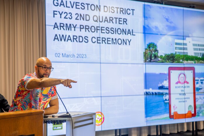 Carlos Gomez, Deputy Public Affairs Chief for U.S. Army Corps of Engineers, Galveston District talks to attendees of the district’s Fiscal Year 2023, 2nd Quarter Award Ceremony and Town Hall as the master of ceremonies