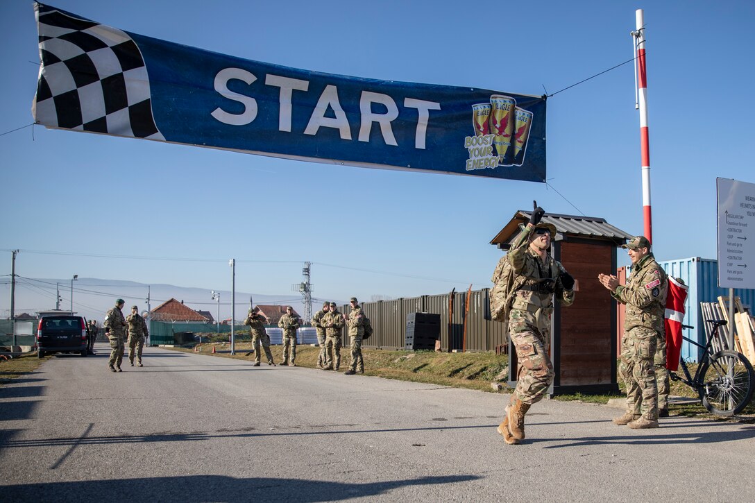 Five hundred and forty-five Soldiers from 21 nations across Kosovo Force Regional Command-East (KFOR RC-E) participate in the traditional Danish Contingency (DANCON) March of 24.27 kilometers near Camp Novo Selo, Kosovo, Jan. 7, 2023.