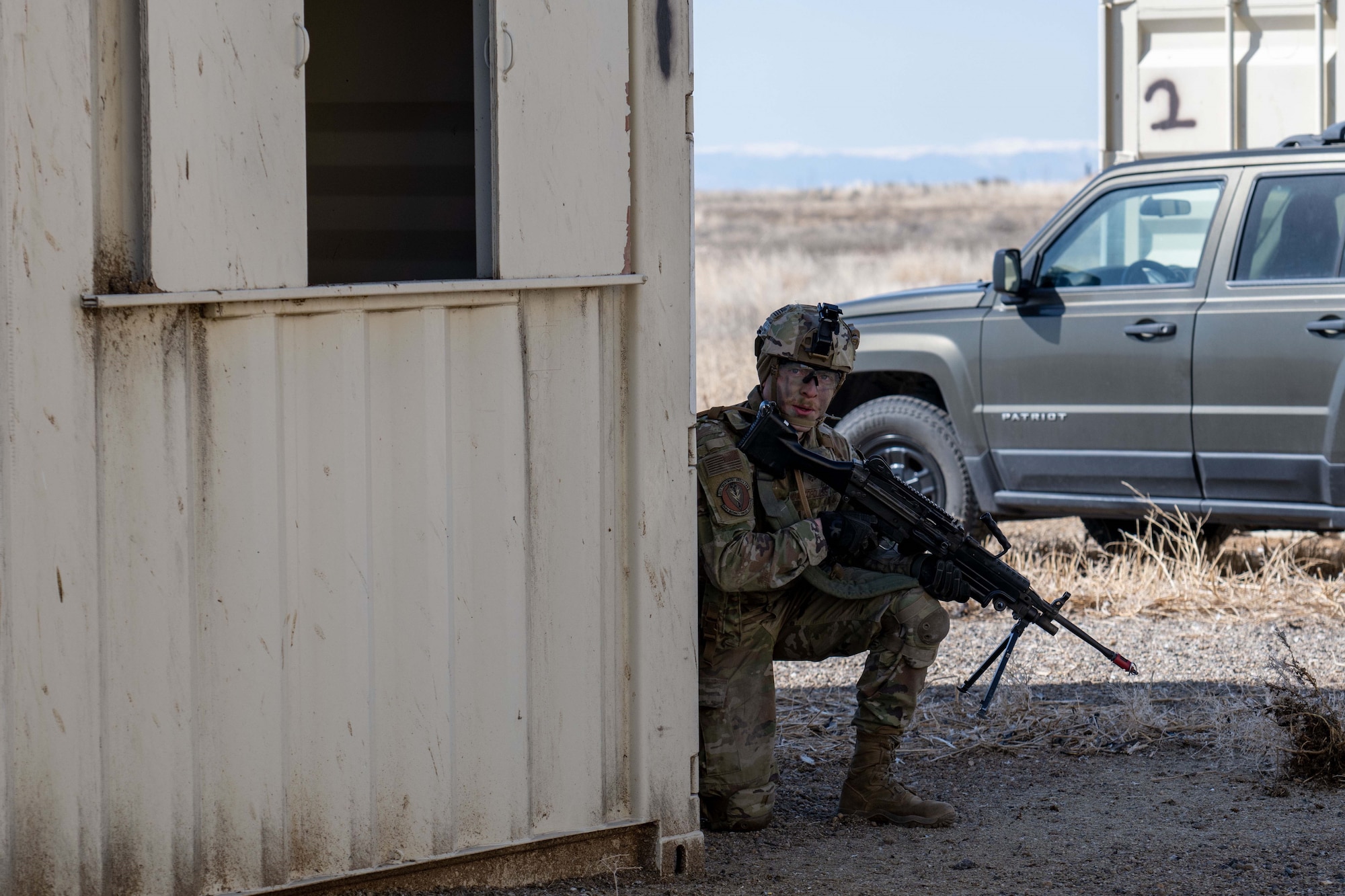 Photo of Airman kneeling