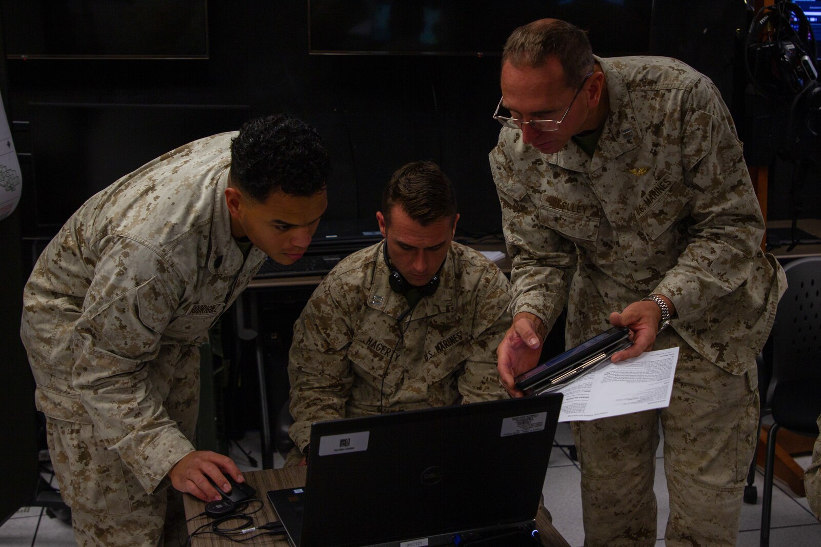 U.S. Marines with Tactical Training and Exercise Control Group, conduct training in a virtual battlespace at the Battle Simulation Center