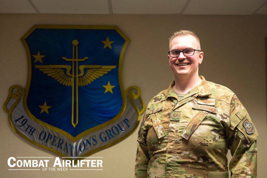 man in uniform poses for a photo