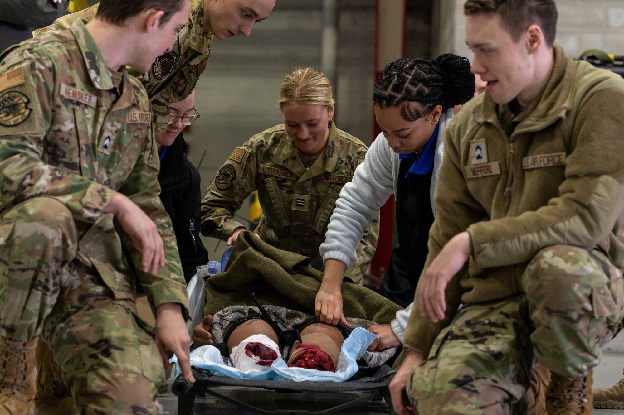 Cadets picking up a stretcher