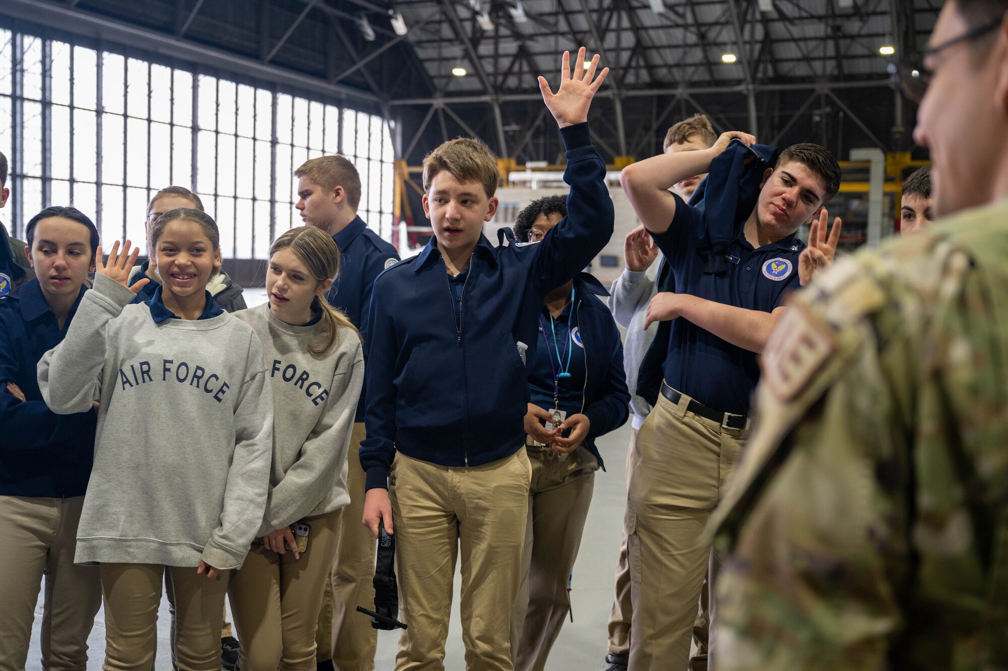 Kids raising hands