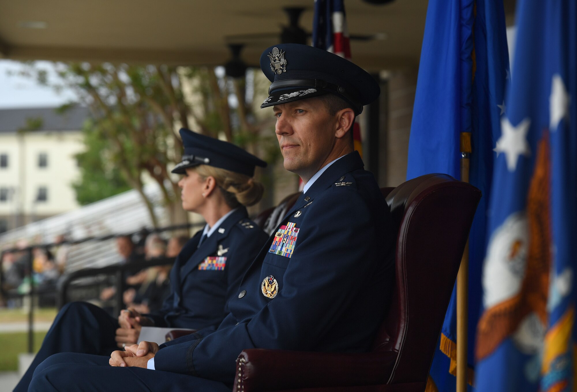 U.S. Air Force Col. Billy Pope, 81st Training Wing commander, sits on stage during an assumption of command ceremony on the Levitow Training Support Facility drill pad at Keesler Air Force Base, Mississippi, March 23, 2023.