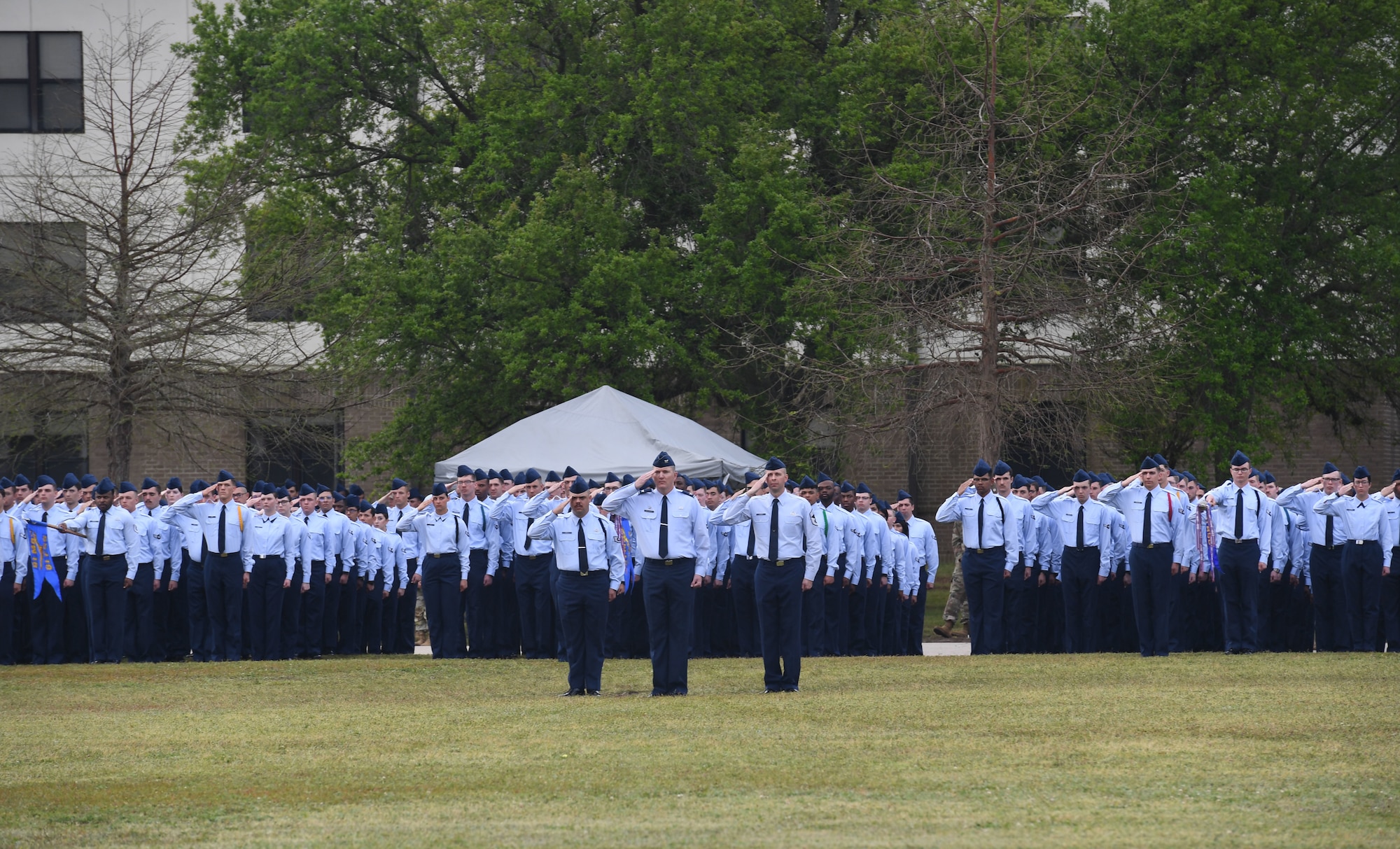 Keesler Airmen render a salute during the 81st Training Wing assumption of command ceremony on the Levitow Training Support Facility drill pad at Keesler Air Force Base, Mississippi, March 23, 2023.