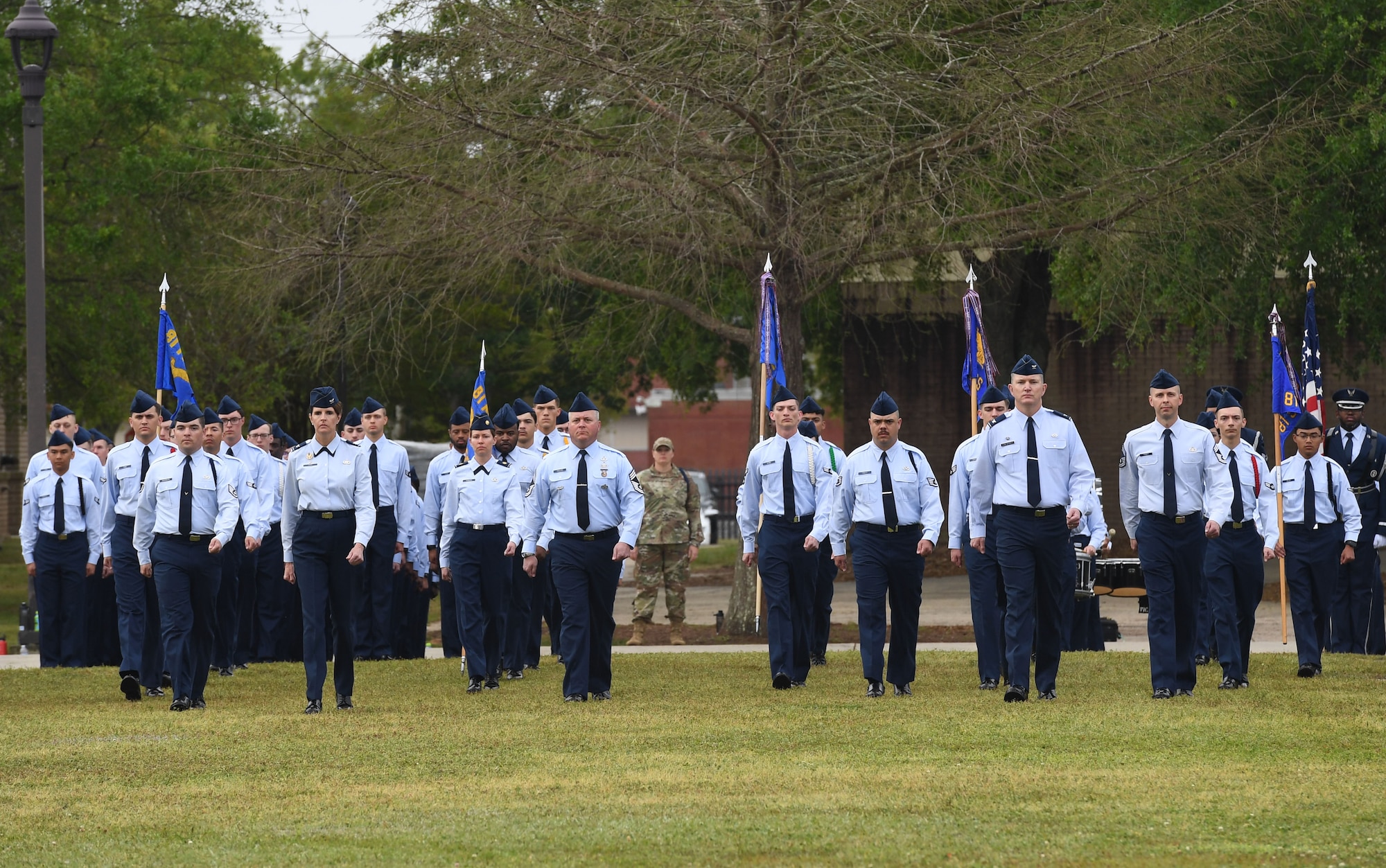 Keesler leadership march in formation during the 81st Training Wing assumption of command ceremony on the Levitow Training Support Facility drill pad at Keesler Air Force Base, Mississippi, March 23, 2023.