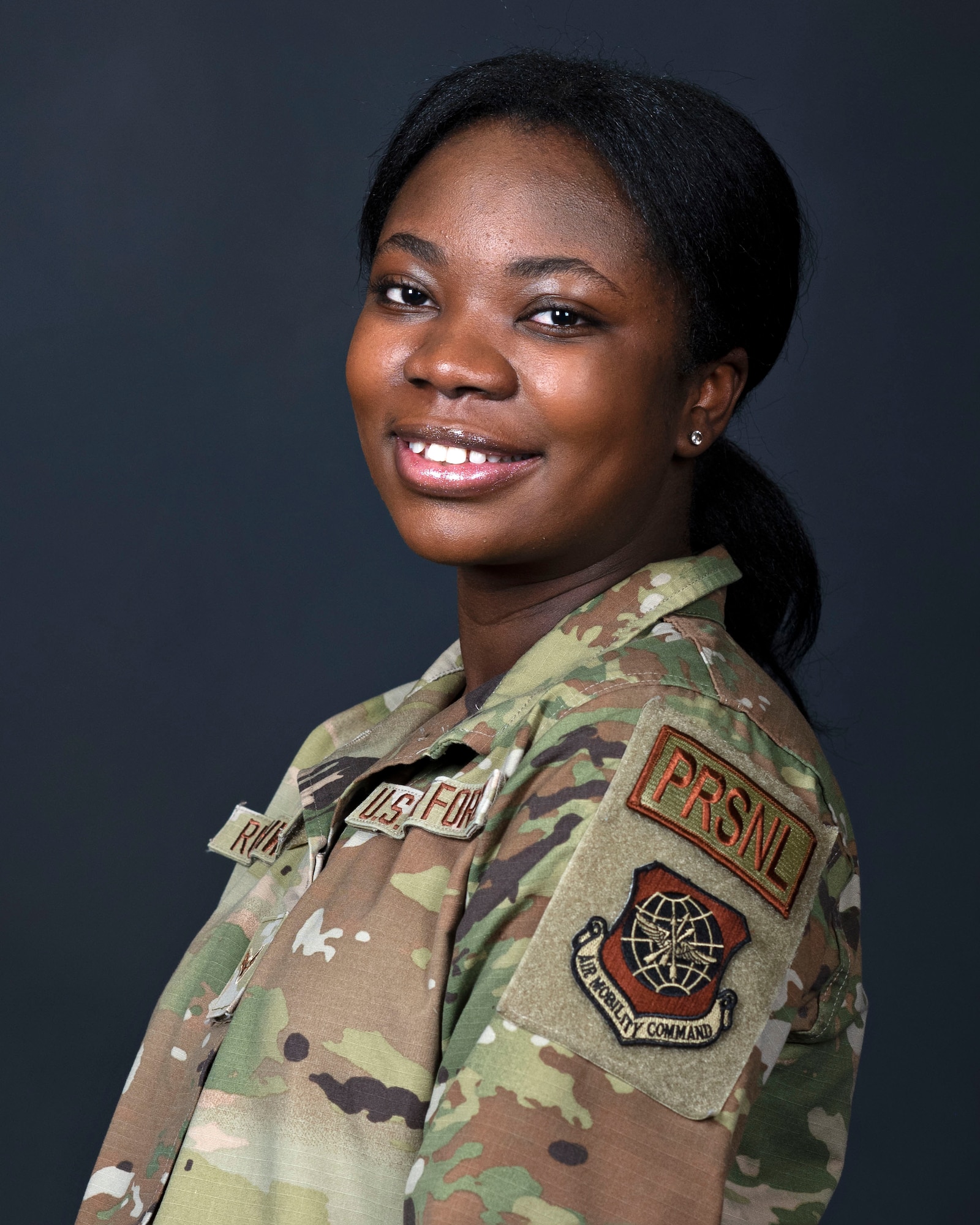 U.S. Air Force Airman 1st Class Vera Rushwaya, 92nd Force Support Squadron customer service technician, poses for a portrait photo at Fairchild Air Force Base, Washington, March 22, 2023. Rushwaya moved from Ghana to the United States when she was 14 and joined the military when she was 21. (U.S. Air Force photo by Airman 1st Class Morgan Dailey)