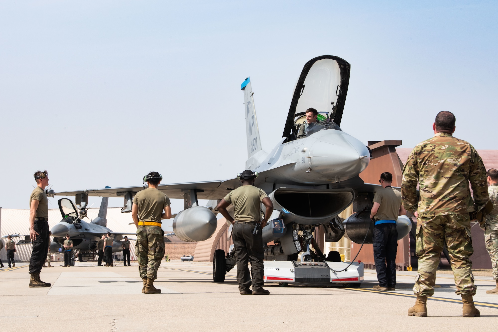 Photo of Airmen, F-16s landing at Osan