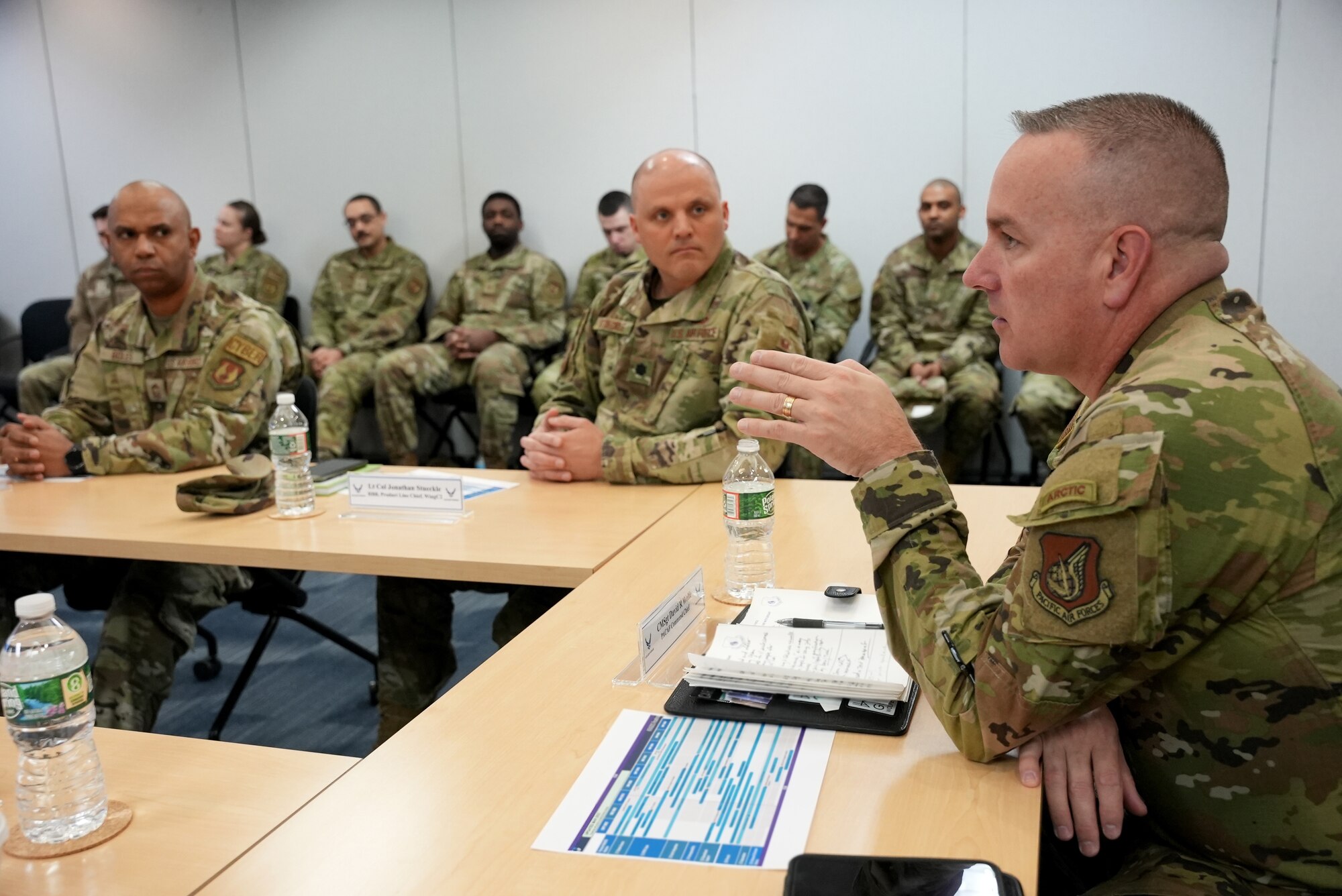 Chief Master Sgt. David R. Wolfe, right, asks questions during a brief at Kessel Run’s office here, March 20, 2023. Wolfe visited Kessel Run to educate Airmen on the current state of the Pacific Region and learn more about Kessel Run’s applications. Wolfe is the command chief master sergeant for Pacific Air Forces, Joint Base Pearl Harbor-Hickam, Hawaii. (U.S. Air Force photo by Richard Blumenstein)