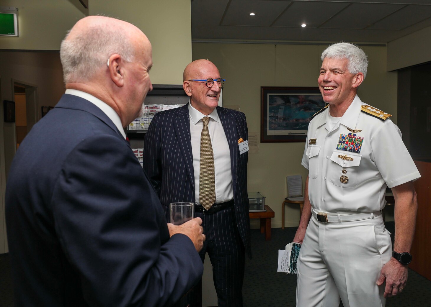 BRISBANE, Australia (March 15, 2023) – Vice Adm. Karl Thomas, commander, U.S. 7th Fleet, greets Professor Alan Patching and Mr. Chris Johnson, Chairman of the General Douglas MacArthur Brisbane Memorial Foundation Limited, during a ceremony for the 80th anniversary of the formation of the U.S. 7th Fleet at the Macarthur Museum in Brisbane, Australia, March 15. 7th Fleet is the U.S. Navy's largest forward-deployed numbered fleet, and routinely interacts and operates with Allies and partners in preserving a free and open Indo-Pacific region. (U.S. Navy photo by Mass Communication Specialist 1st Class Deanna C. Gonzales)