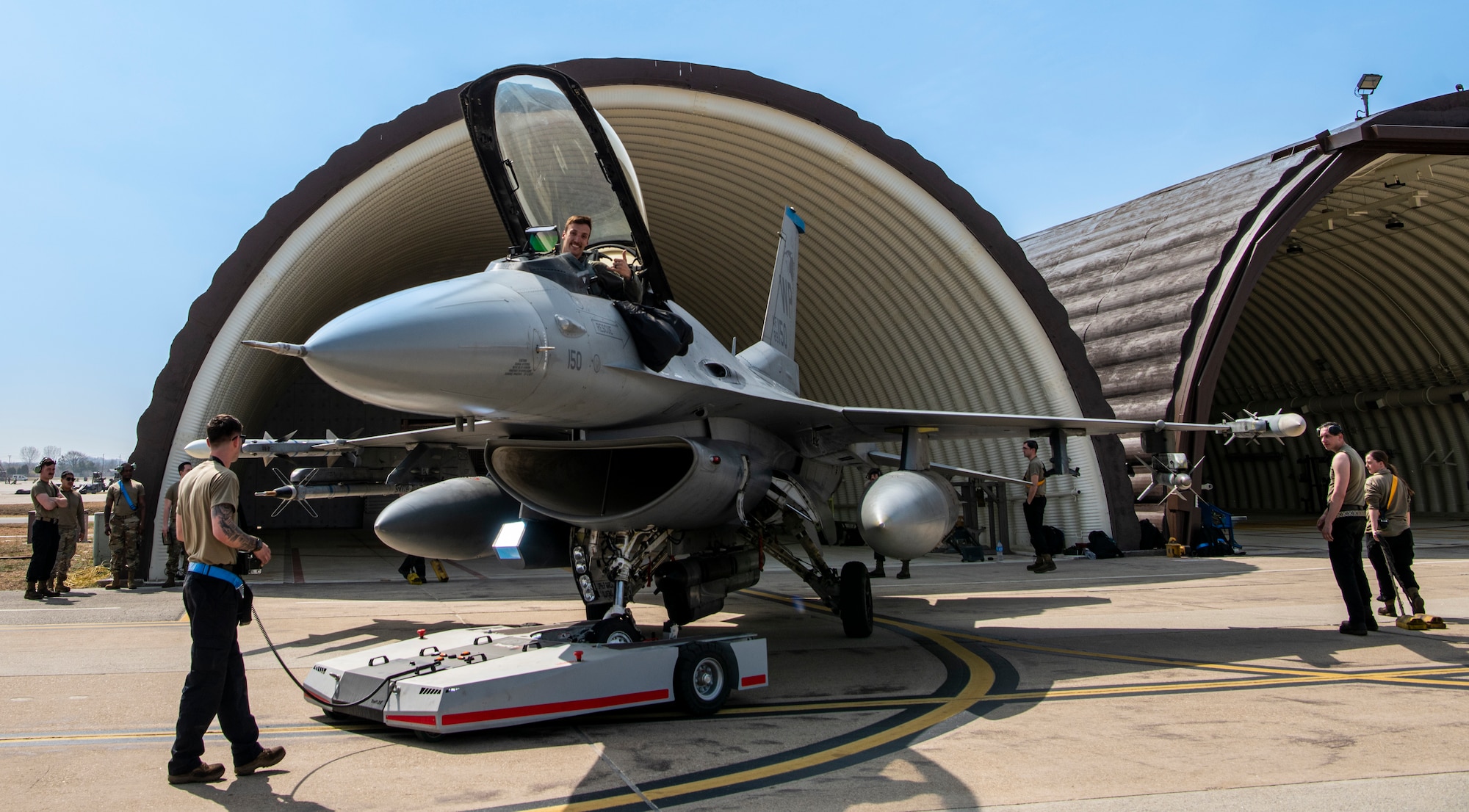 U.S. Air Force Airmen assigned to the 35th Fighter Generation Squadron, Kunsan Air Base, park an F-16 Fighting Falcon at Osan AB, Republic of Korea, March 22, 2023.