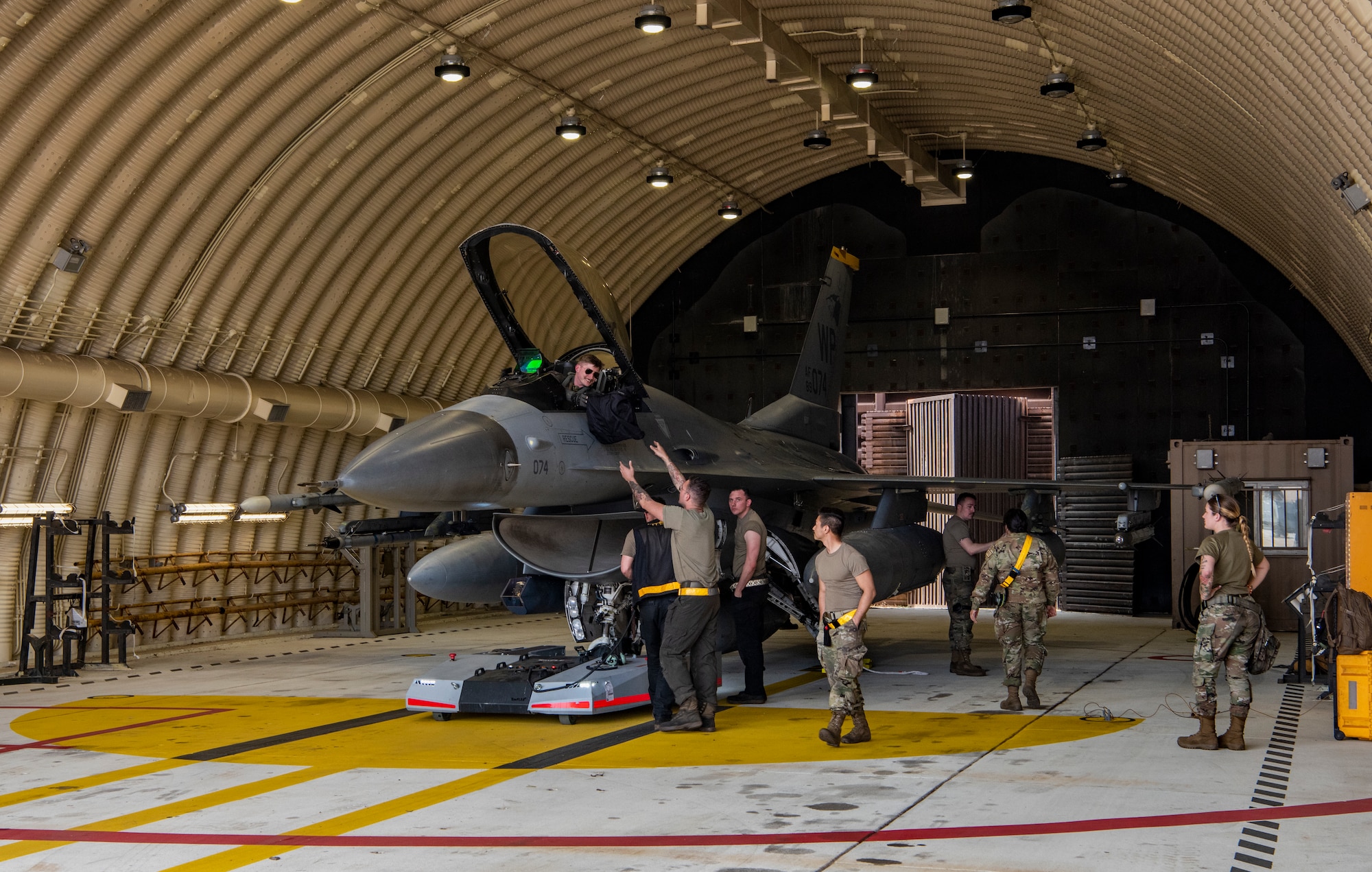 U.S. Air Force Airmen assigned to the 80th Fighter Generation Squadron, Kunsan Air Base, assists a pilot and performs post flight checks on an F-16 Fighting Falcon at Osan AB, Republic of Korea, March 22, 2023.