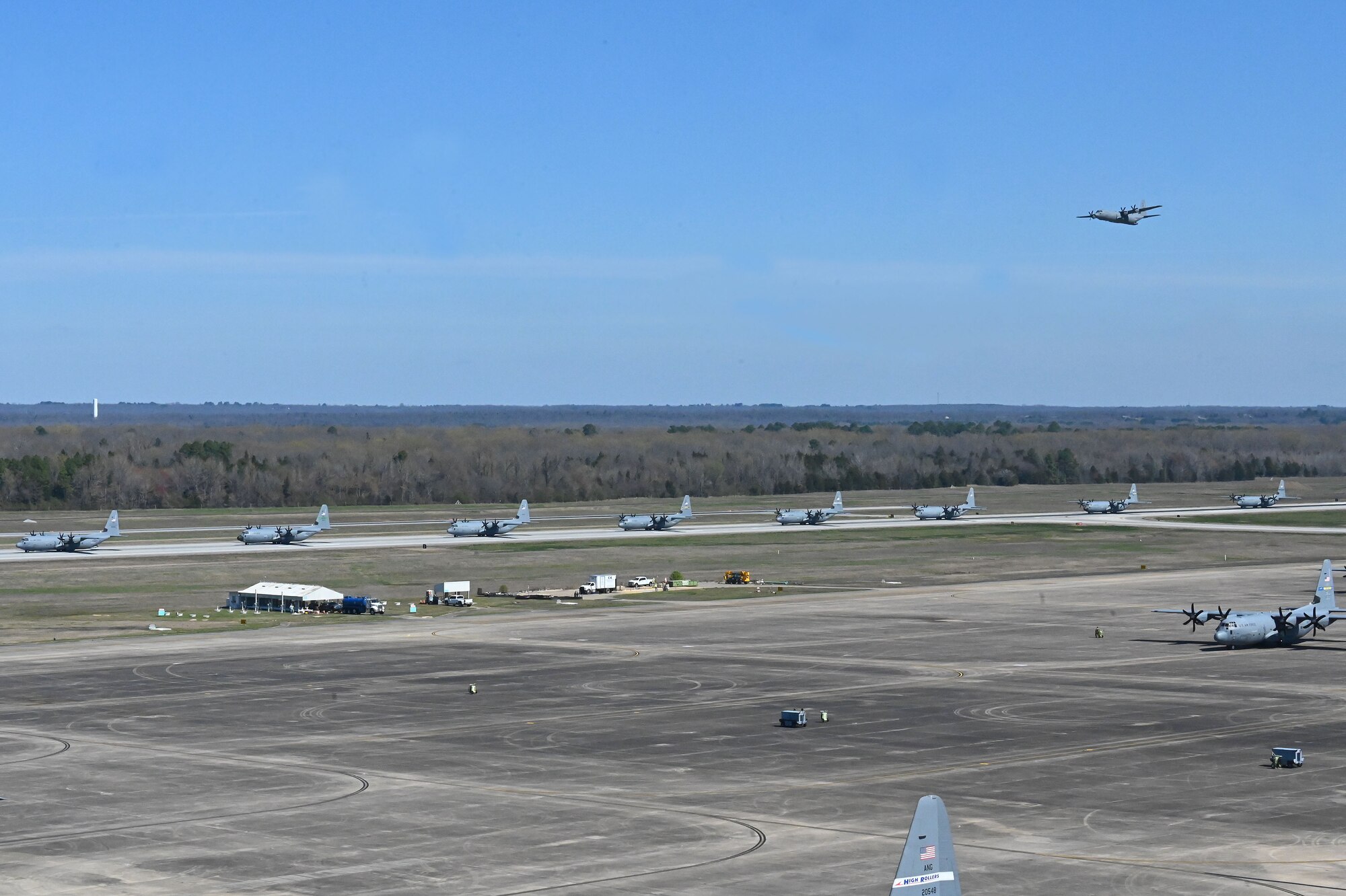 C-130s taxi on the runway