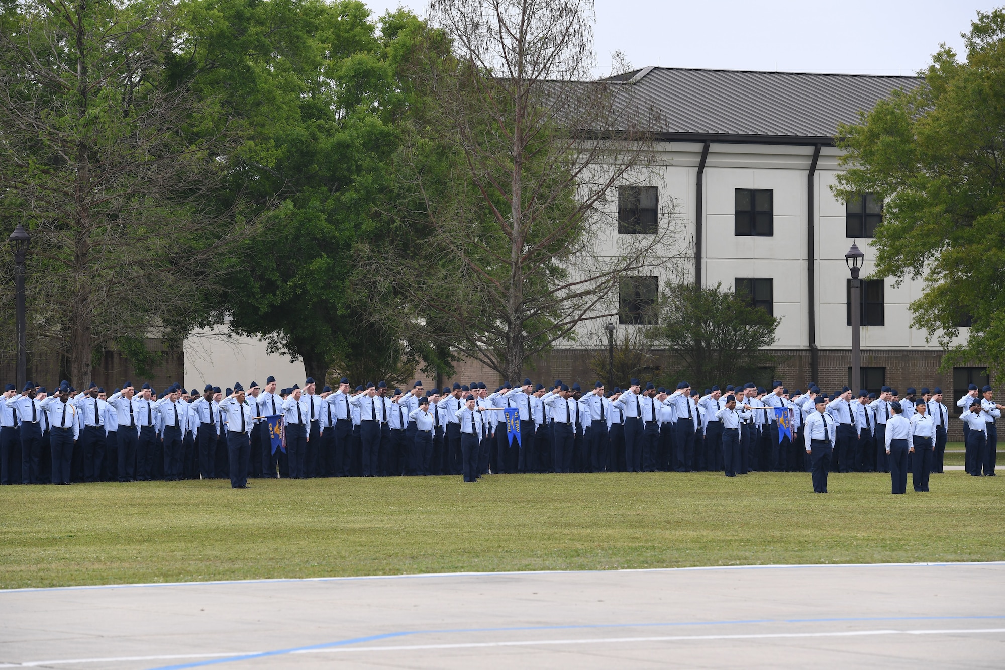 Keesler Airmen render a salute during the 81st Training Wing assumption of command ceremony on the Levitow Training Support Facility drill pad at Keesler Air Force Base, Mississippi, March 23, 2023.