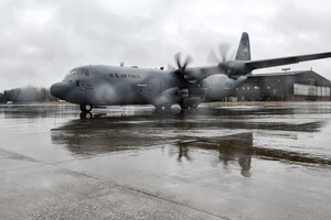 Senior Airman Danielle Clayton, an aerospace maintenance specialist with the 910th Aircraft Maintenance Squadron, waits to marshal in a C-130J Super Hercules aircraft assigned to the 130th Airlift Wing, McLaughlin Air National Guard Base, West Virginia, on Feb. 22, 2023, at Youngstown Air Reserve Station, Ohio.