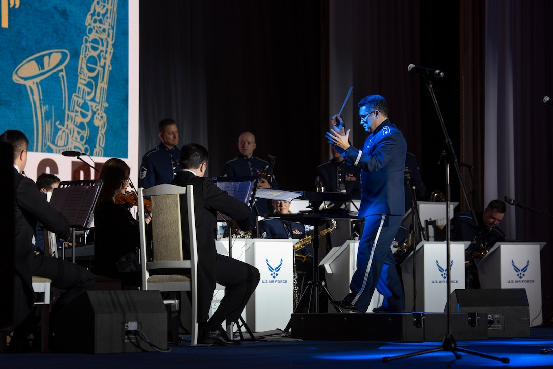 A man conducts a band