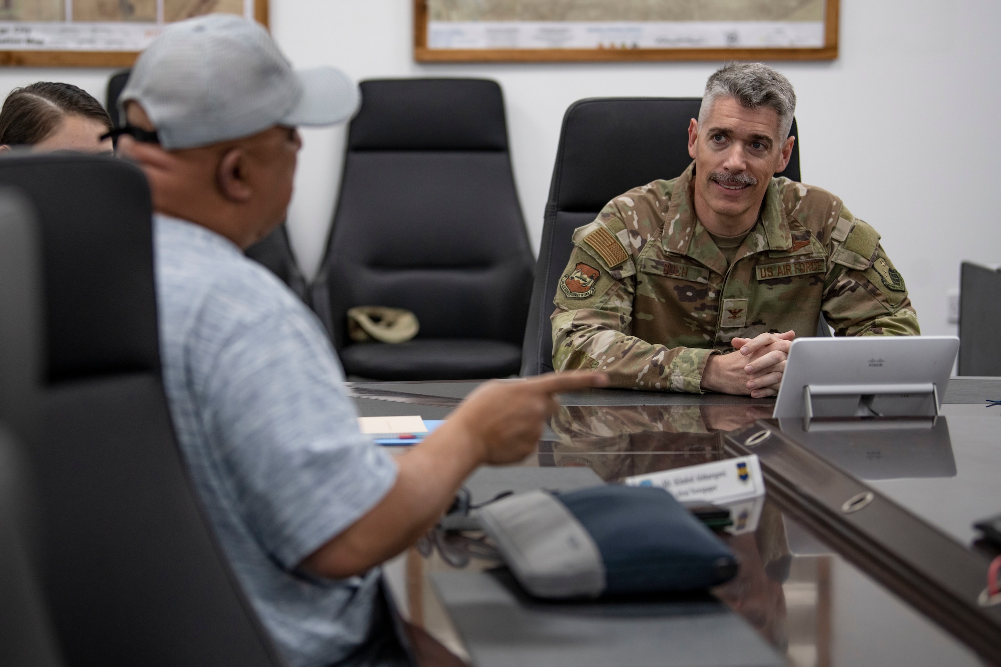 U.S. Air Force Col. George Buch, 386th Air Expeditionary Wing commander, briefs Kuwaiti newspaper journalists during Media Day at Ali Al Salem Air Base, Kuwait, March 21, 2023.