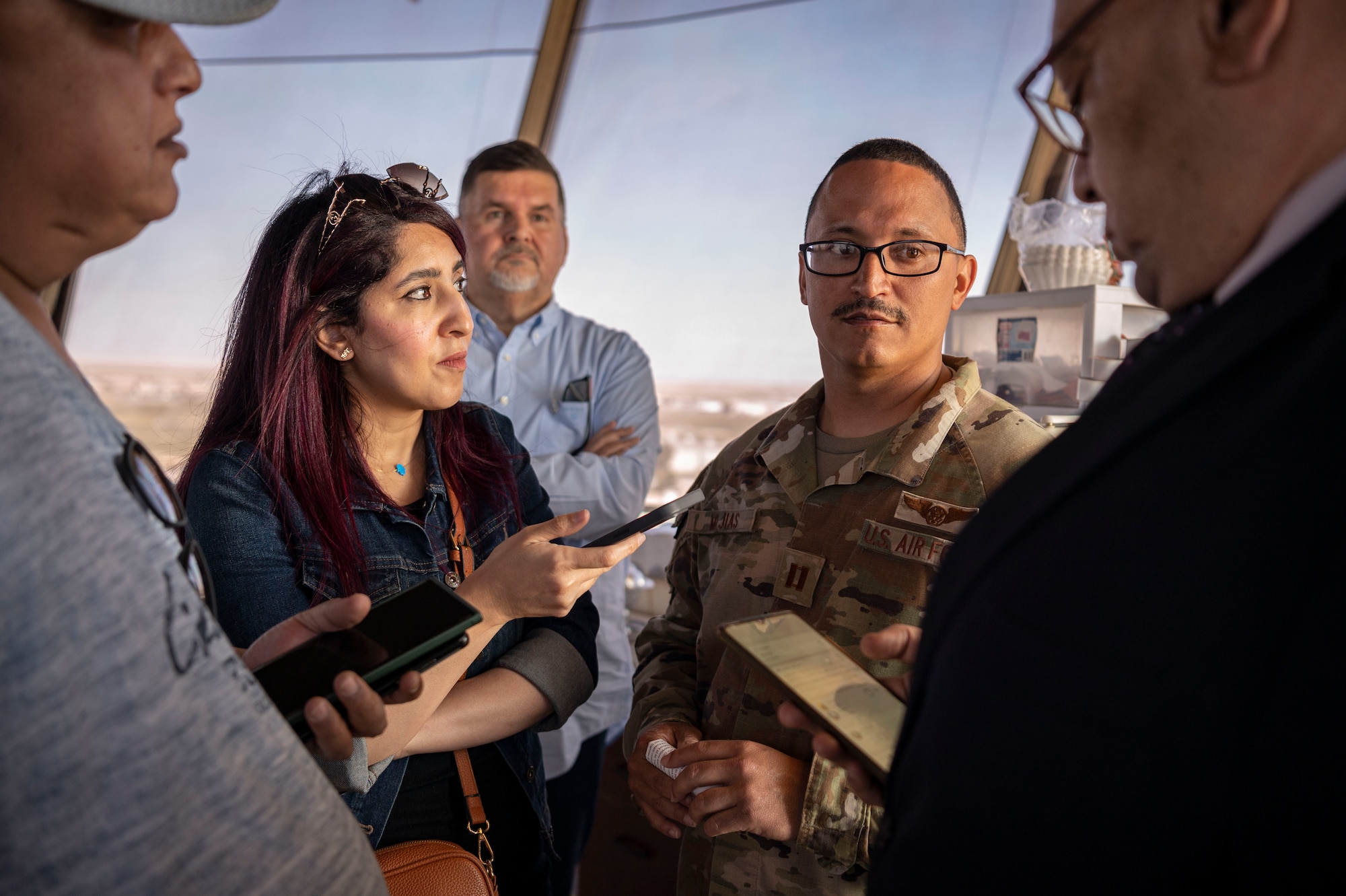 U.S. Air Force Capt. Carlos Mejias, the 407th Expeditionary Operations Support Squadron airfield operations flight commander, answers Kuwaiti newspaper journalists’ questions about the air traffic control tower during Media Day at Ali Al Salem Air Base, Kuwait, March 21, 2023.
