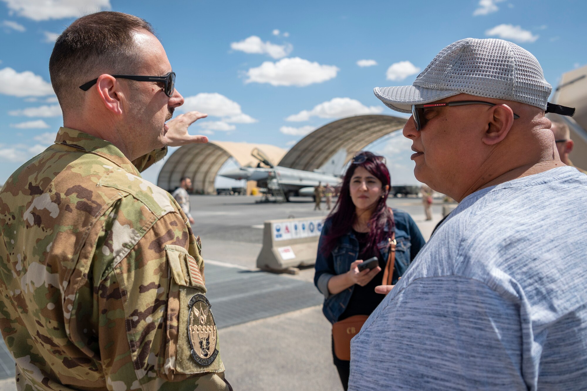 U.S. Air Force Chief Master Sgt. Lawrence Buell, 386th Expeditionary Civil Engineer Squadron , explains to Kuwait newspaper journalists what they are about to see during Media Day at Ali Al Salem Air Base, Kuwait, March 21, 2023.