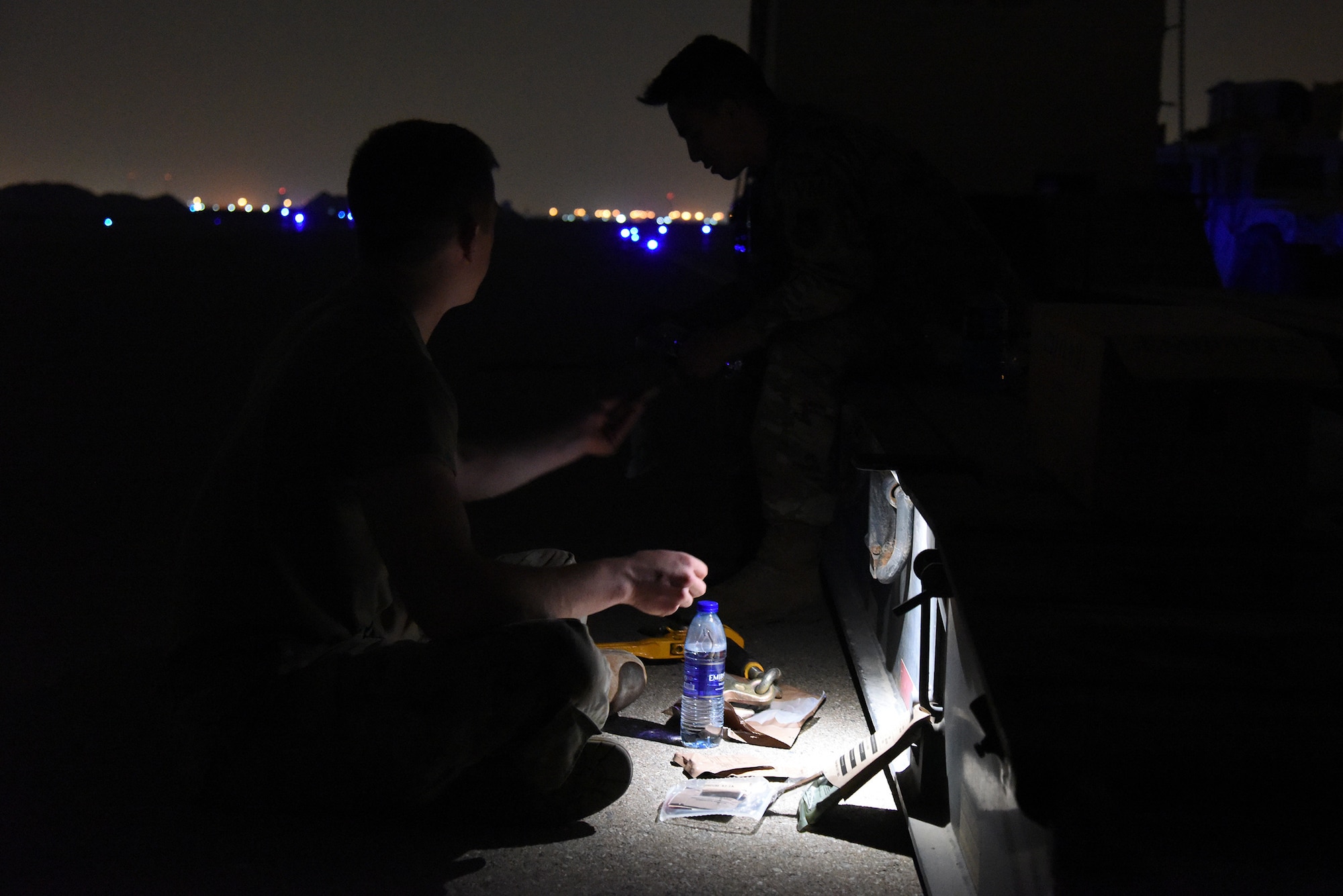 U.S. Air Force Airman First Class Tyler King, Multi-Capable Airman Team 1 member, prepares his Meal Ready to Eat in the early morning hours during the Operation Agile Spartan 4 exercise at Al Dhafra Air Base, United Arab Emirates, March 10, 2023. Operation Agile Spartan 4 tested Al Dhafra AB’s Multi-Capable Airmen’s abilities to launch, receive, and recover air frames in remote locations. (U.S. Air Force photo by Tech. Sgt. Chris Jacobs/released)