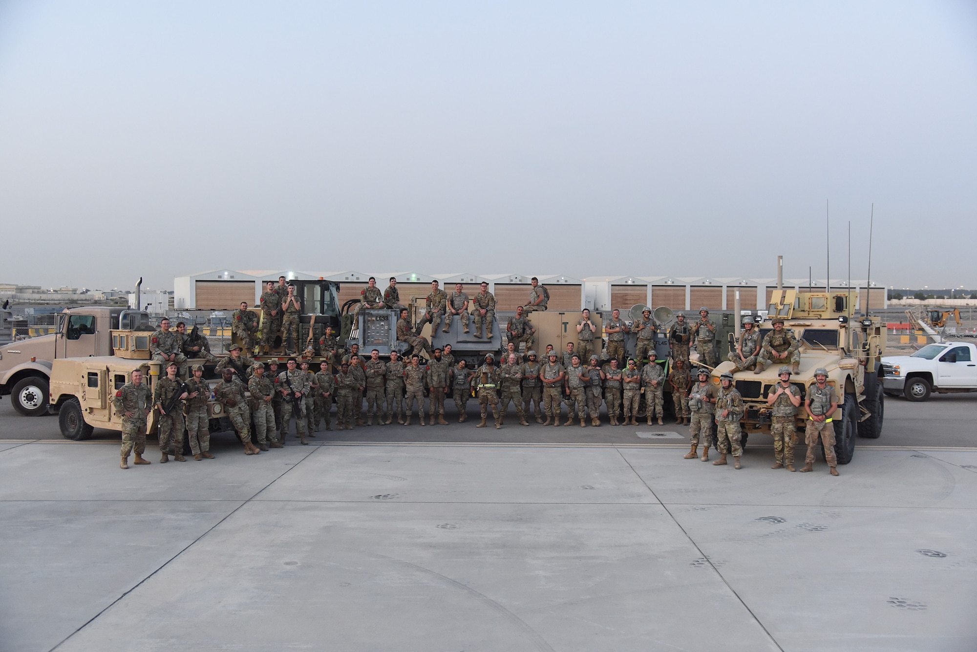 Service members from across Al Dhafra Air Base, United Arab Emirates, pose for a group photo during the Operation Agile Spartan 4 exercise March 11, 2023. The exercise took place throughout the U.S. Air Force Central Command’s area of responsibility and included exercising of Agile Combat Employment and Multi-Capable Airman skills. (U.S. Air Force photo by Tech. Sgt. Chris Jacobs/released)
