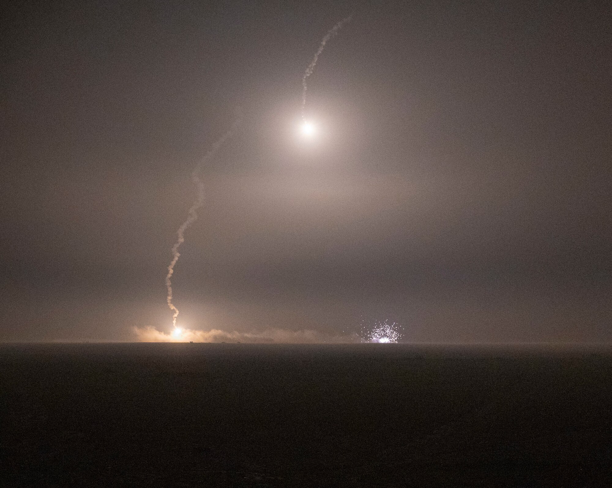 Illumination rounds from a mortar and rounds from an AC-130 called in by a tactical air control party hit a target at Udairi Range, Kuwait, March 14, 2023.