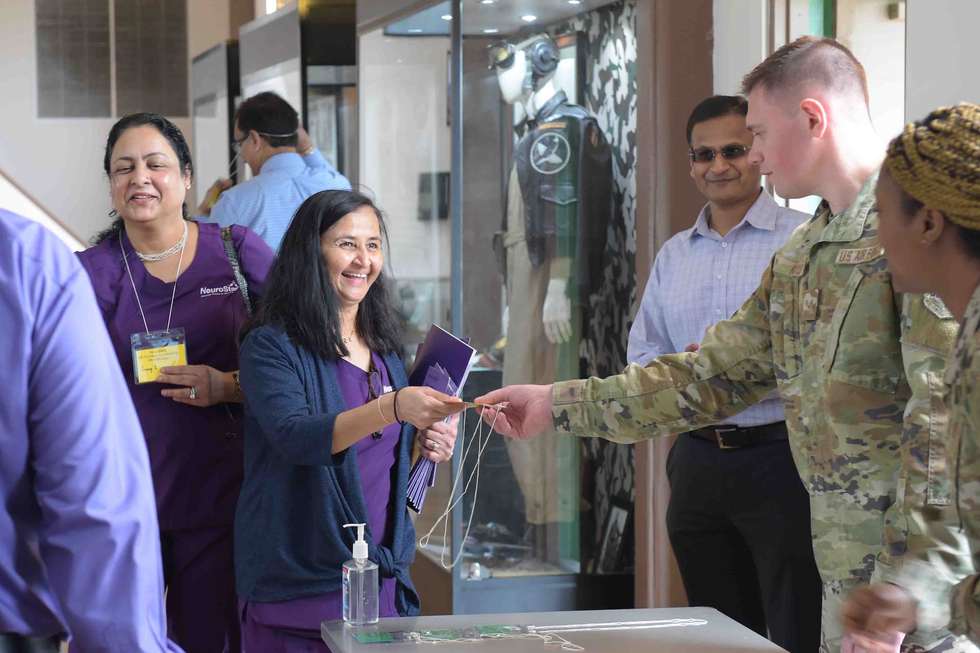 A photo of Airmen greeting people.