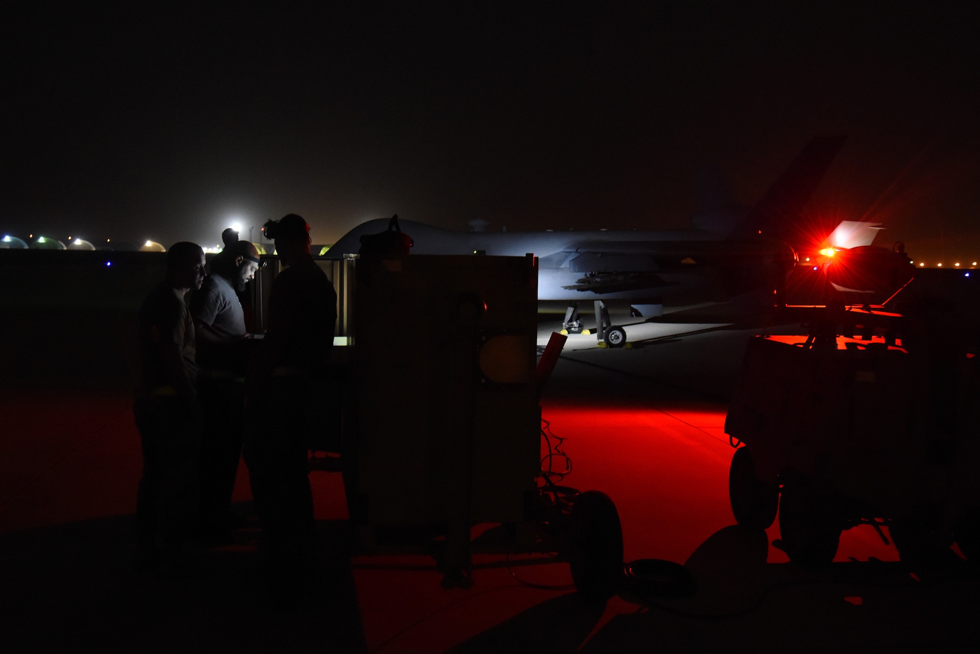 U.S. Air Force airmen from Multi-Capable Airman Team 1 at Al Dhafra Air Base, United Arab Emirates, go over the pre-launch checklist for a U.S. Air Force MQ-9 Reaper during Operation Agile Spartan 4, March 10, 2023. MCA Team 1 spent more than 24-hrs. in a simulated austere environment and was able to successfully launch and recover aircraft and move locations during that time. (U.S. Air Force photo by Tech. Sgt. Chris Jacobs/released)