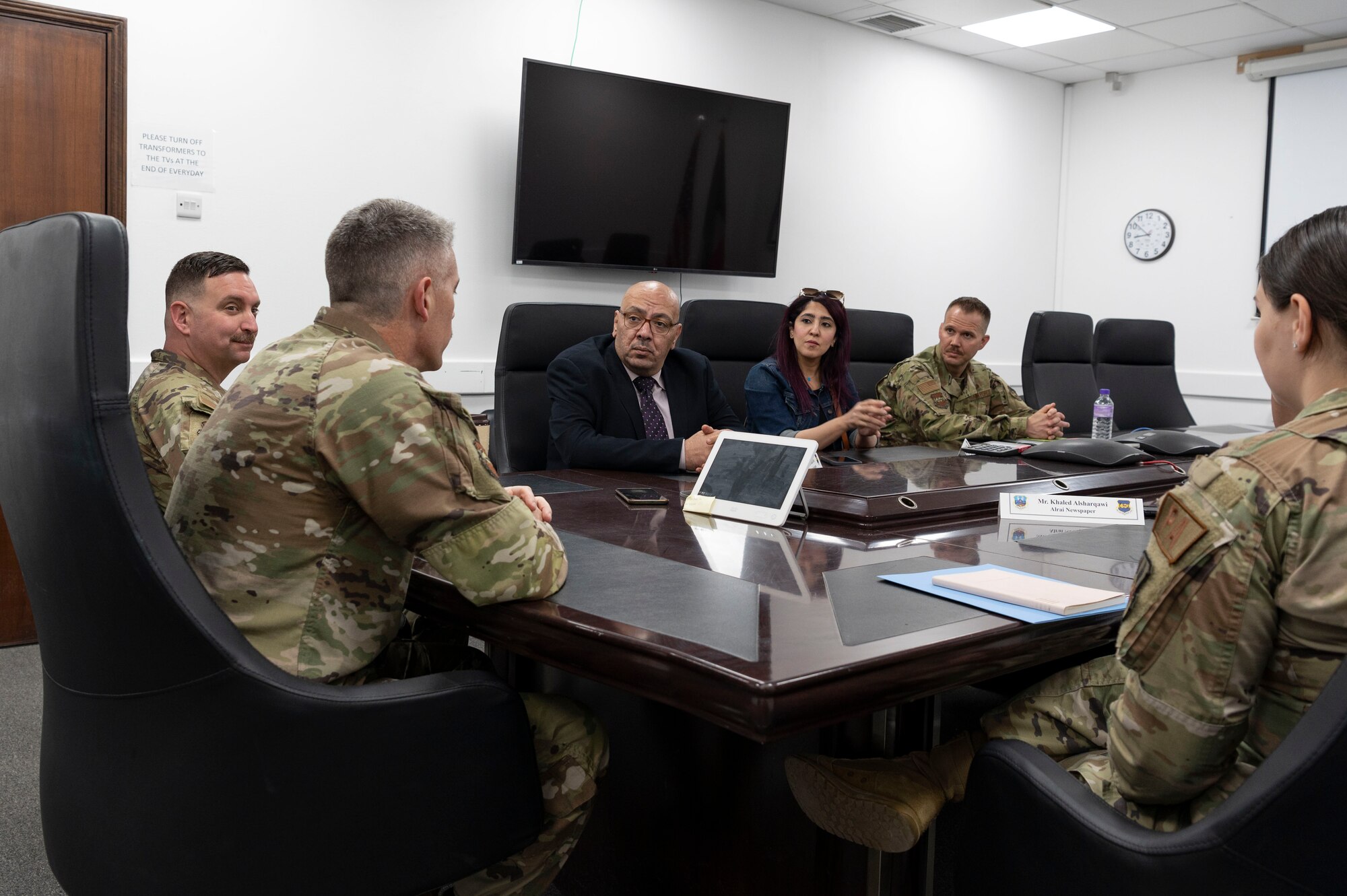 U.S. Air Force Col. George Buch, 386th Air Expeditionary Wing commander, briefs Kuwaiti newspaper journalists during Media Day at Ali Al Salem Air Base, Kuwait, March 21, 2023.