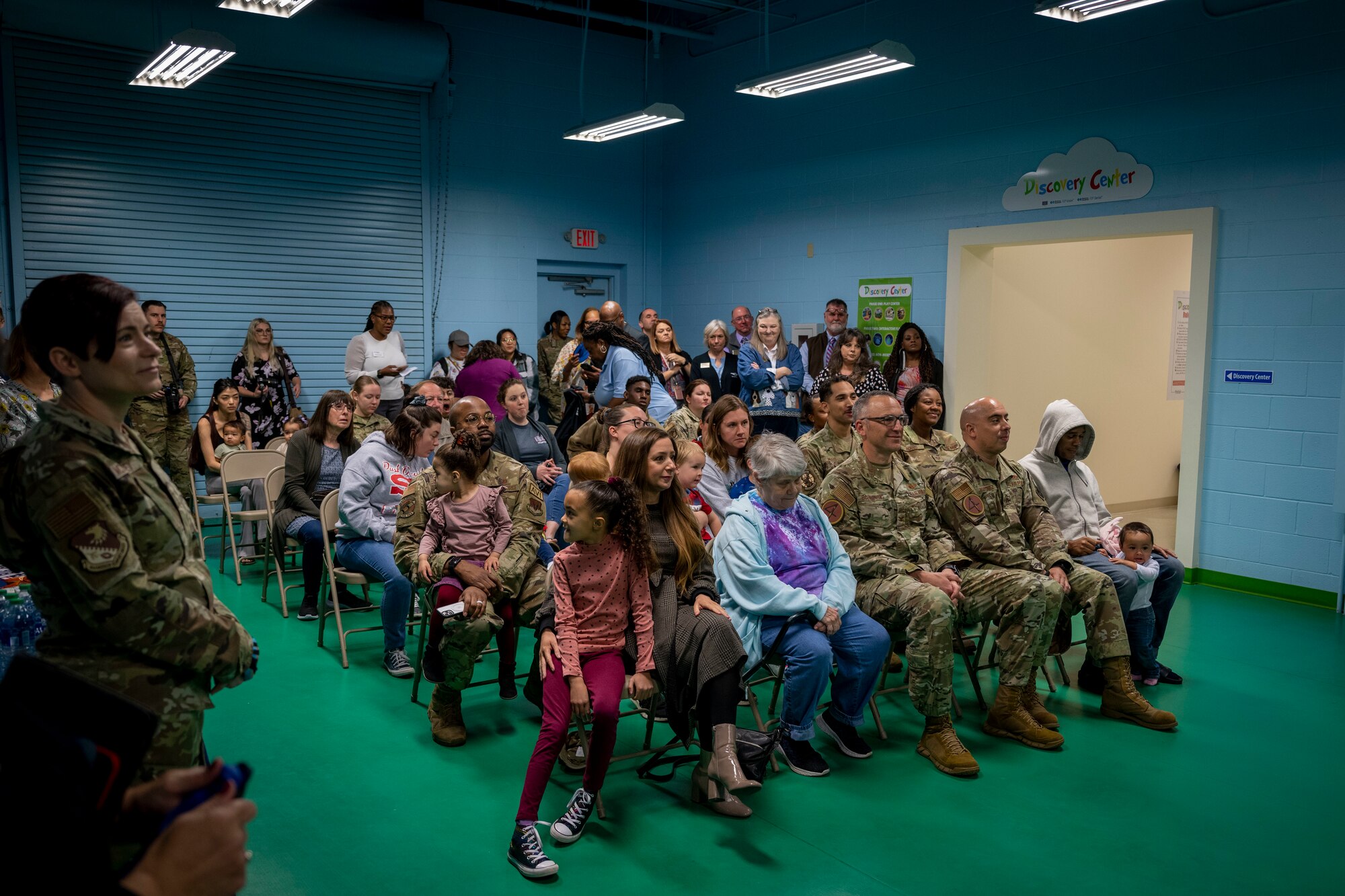 Airmen assigned to the 4th Fighter Wing attend the Discovery Center Ribbon Cutting Ceremony at Seymour Johnson Air Force Base, North Carolina, March 23, 2023. The Discovery Center, housed in the Kiddie Hawk play area, is comprised of hands-on interactive play centers.