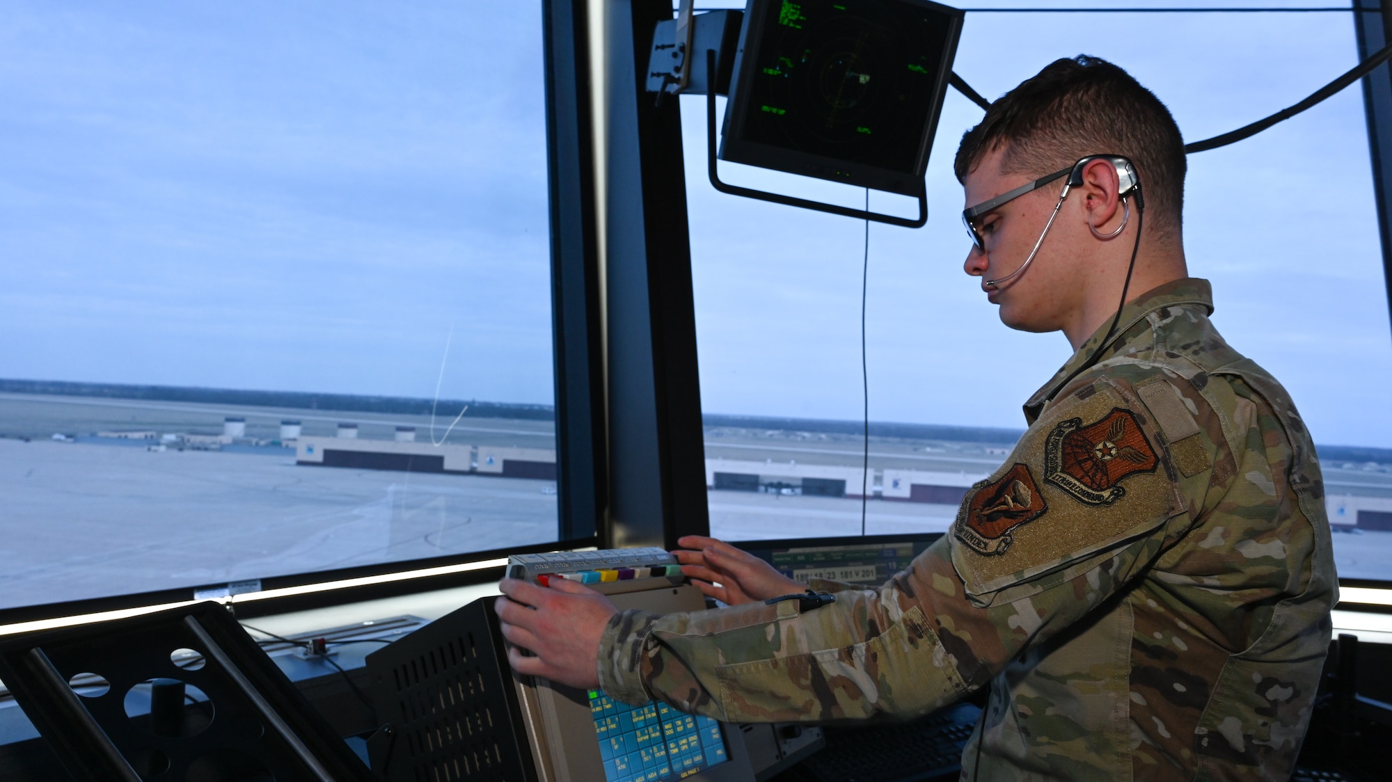 U.S. Air Force Airman 1st Class Dylan Collins, 509th Operations Support Squadron Air Traffic Control apprentice, tracks aircraft activity at Whiteman Air Force Base, Mo., March 15, 2023. Air traffic controllers safely separate aircraft, sequence aircraft and issue safety alerts. (U.S. Air Force photo by Airman 1st Class Hailey Farrell)