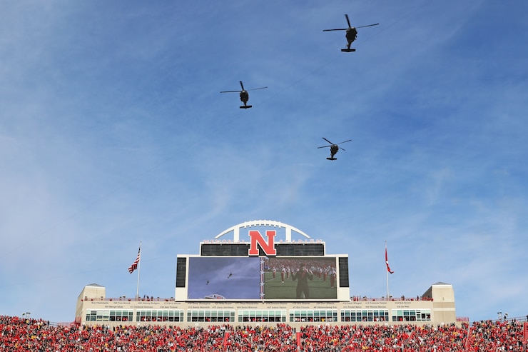 Three Nebraska Army National Guard UH-60L Blackhawk helicopters fly above Memorial Stadium during a pre-game flyover 15 minutes prior to kickoff between the University of Nebraska Cornhuskers and the University of Iowa Hawkeyes football teams Nov. 26, 2021, in Lincoln.