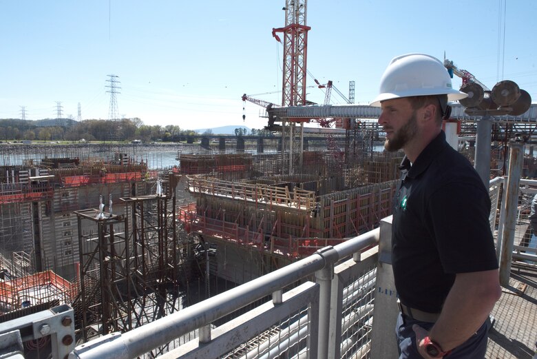 Peter Serodino IV, Serodino, Inc., overlooks construction of the lock chamber for the Chickamauga Lock Replacement Project during a tour March 20, 2023, of the active navigation lock on the Tennessee River in Chattanooga, Tennessee. The U.S. Army Corps of Engineers Nashville District hosted Serodino and other stakeholders for a roundtable and tour of the project. (USACE Photo by Lee Roberts)