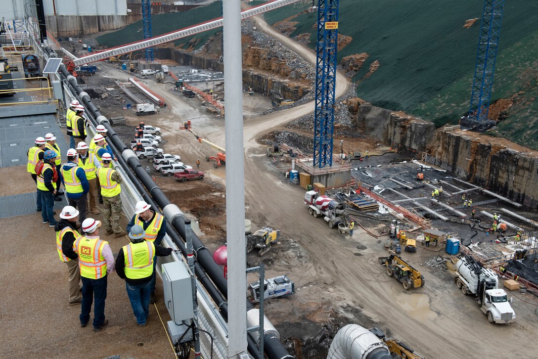 U.S. Army Corps of Engineers Nashville District officials and stakeholders view ongoing construction of the downstream section of the lock chamber during a tour of the active Kentucky Lock and Kentucky Lock Addition Project on the Tennessee River in Grand Rivers, Kentucky. The Nashville District engaged with stakeholders March 22, 2023, to provide an update on the important navigation project and to promote partnerships and communication. (USACE Photo by Lee Roberts)