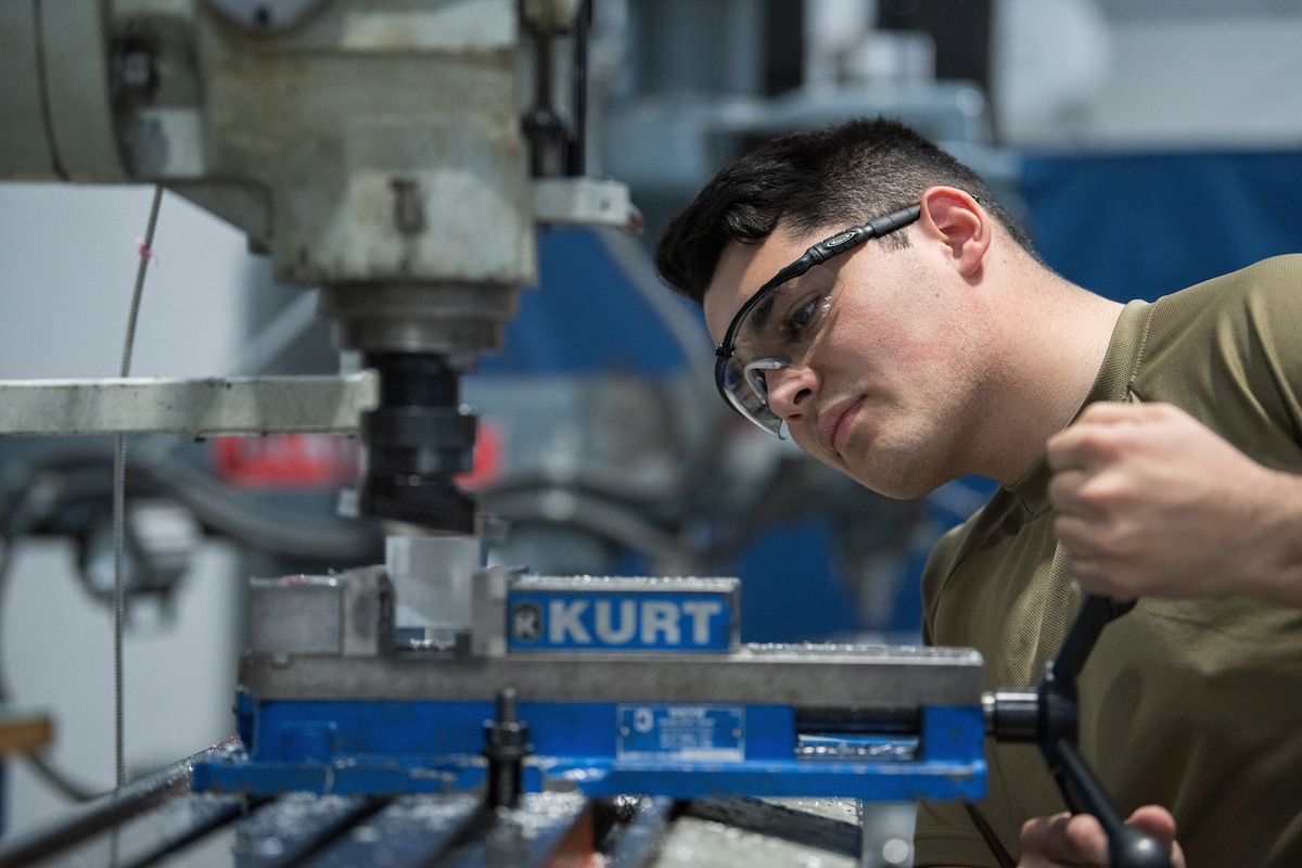 Senior Airman Jeremy Machado , 349 Maintenance Squadron aircraft metals technician works  diligently on fabricating aluminum parts for aircrafts, March 8, 2023.