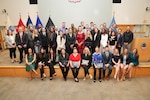 Pathways to Career Excellence program graduates pose with leadership and program facilitators during a graduation ceremony held March 22, at DLA Troop Support, Philadelphia. The two-year program is designed for entry-level personnel to provide advancement in professional, administrative and technological careers within the organization.