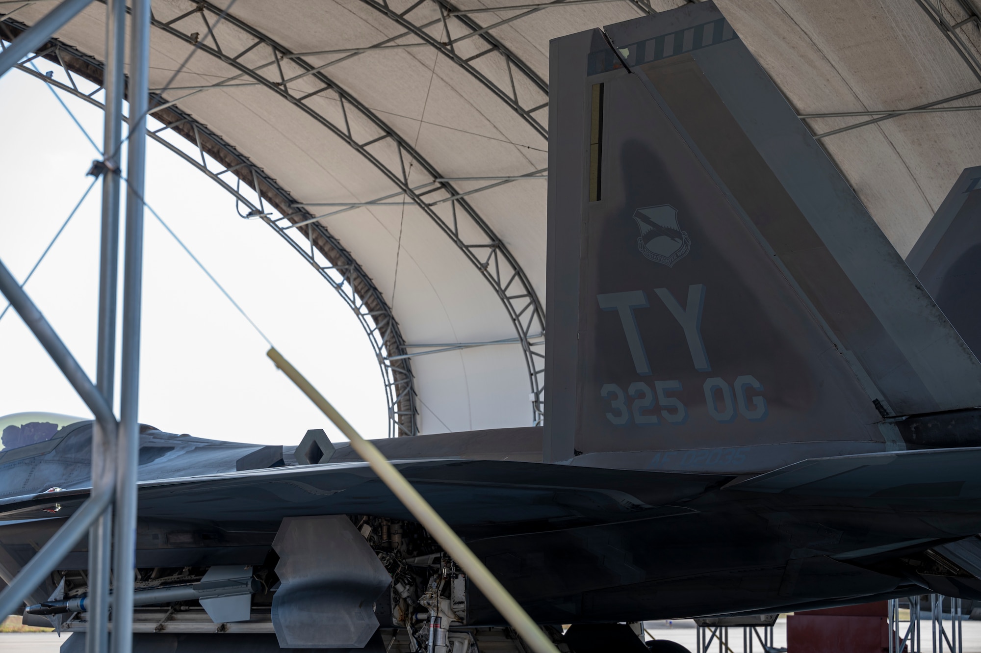 The tail flash of an F-22 Raptor assigned to Tyndall Air Force Base