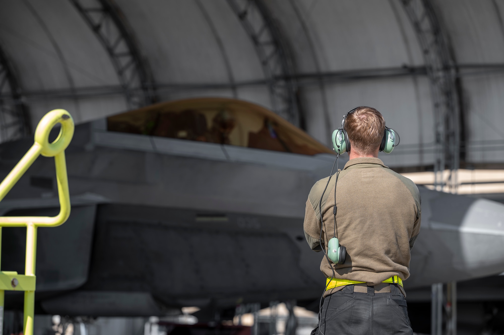 Crew chief prepares to launch aircraft