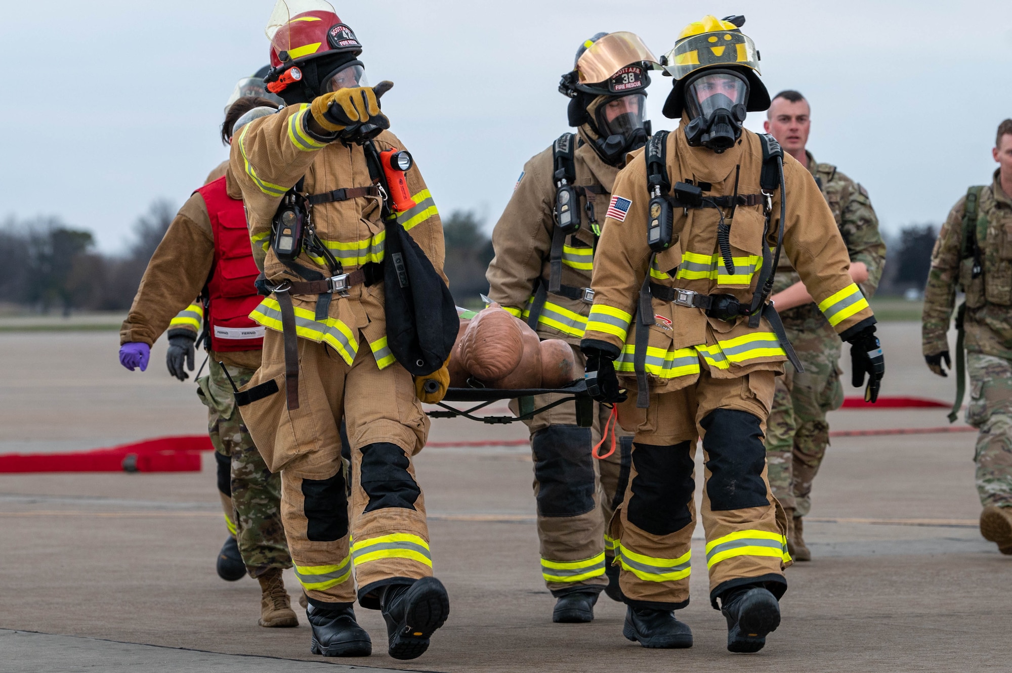 Firefighters carry mannequin