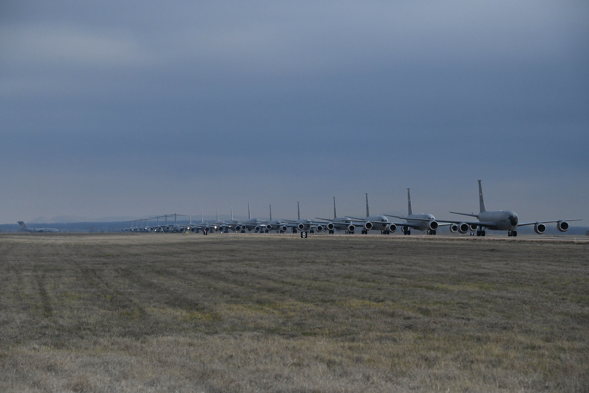 C-17 Globemaster III and KC-46 Pegasus aircraft taxi down the runway at Altus Air Force Base, Oklahoma, during a large force exercise, March 24, 2023. This exercise served as an opportunity for members from all groups to conduct training in the event aircraft need to evacuate the base during a severe weather event. (U.S. Air Force photo by 1st Lt. Elisabeth Teitelman)