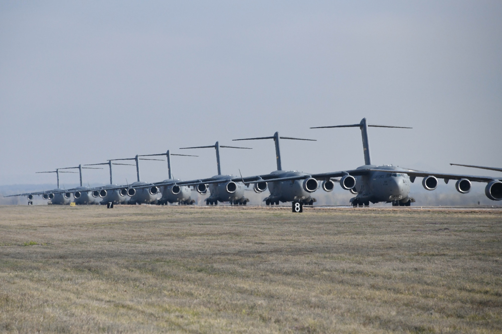 C-17 Globemaster IIIs taxi down the Altus Air Force Base (AFB), Oklahoma, runway during a large force exercise, March 24, 2023. Altus AFB serves as the formal training unit for the C-17. (U.S. Air Force photo by 1st Lt. Elisabeth Teitelman)